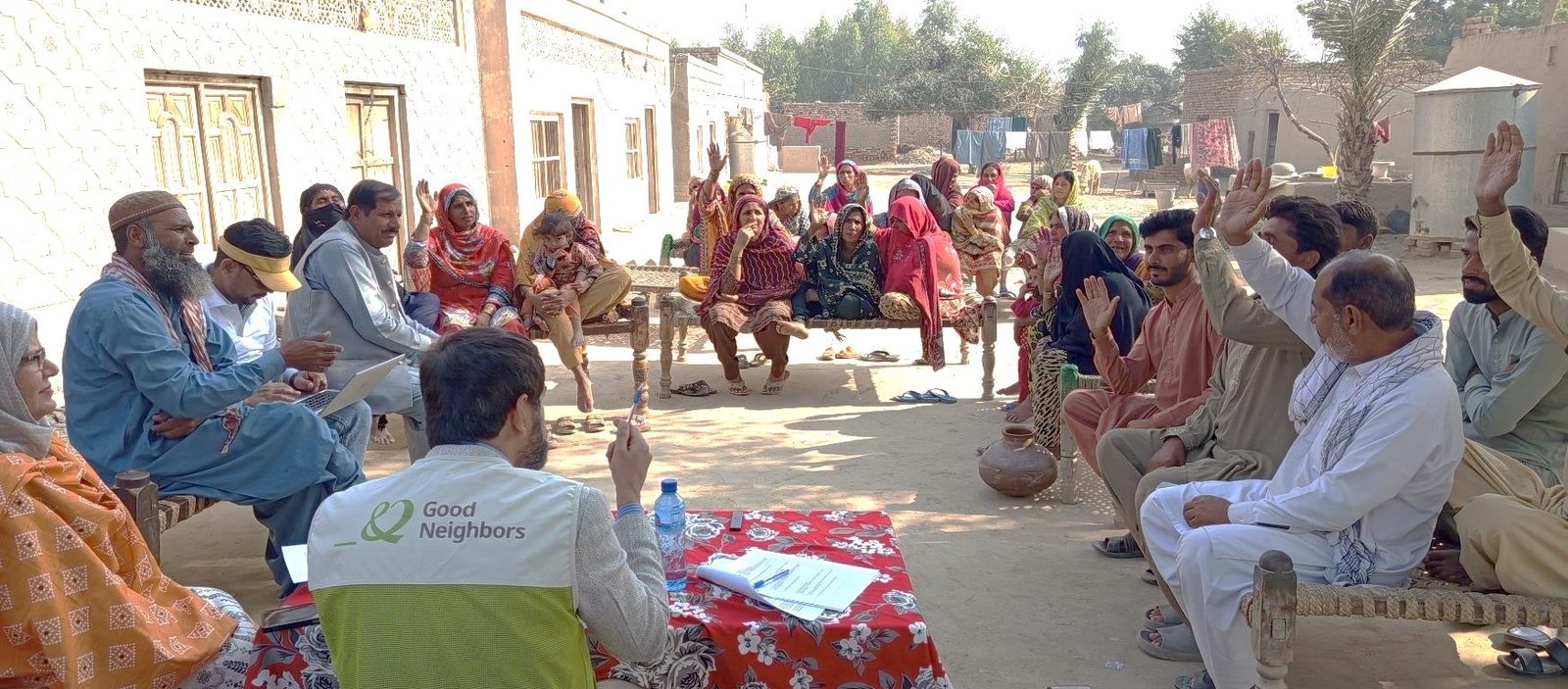 Hamsaaya field team facilitating a community meeting