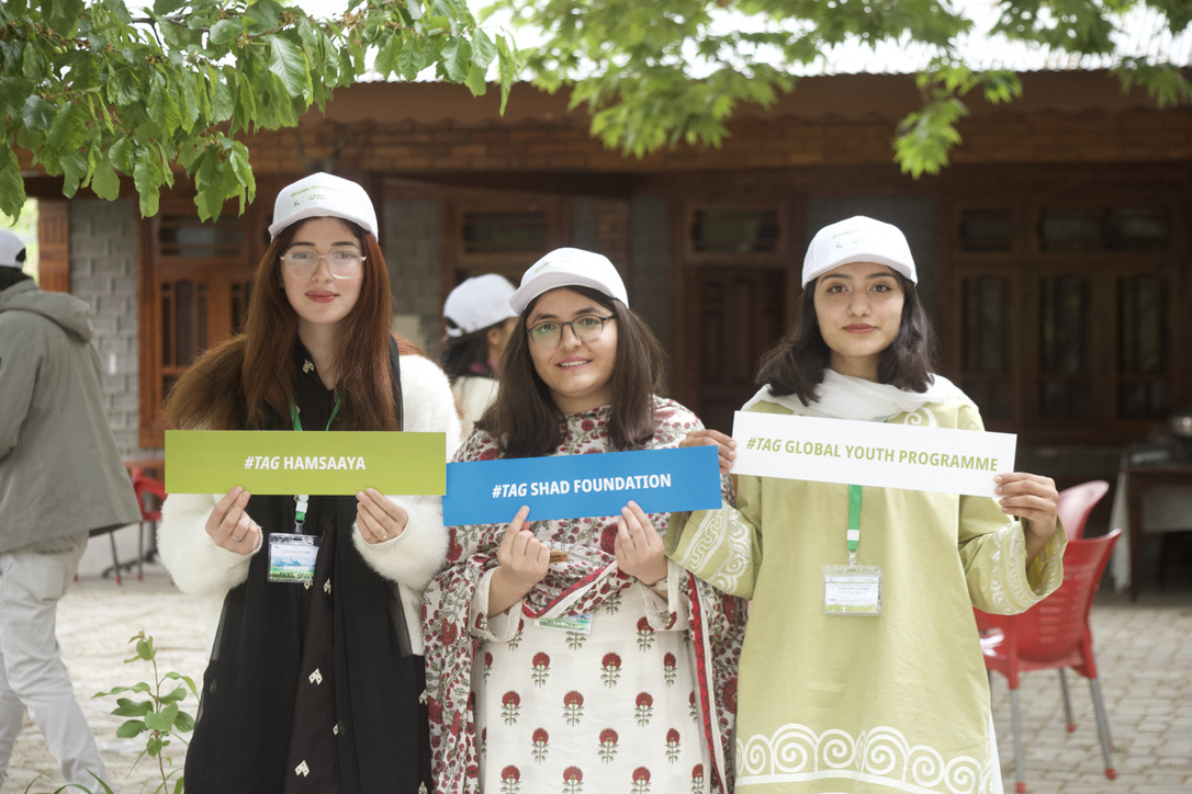 Three Global Youth Programme participants in Chitral holding #TAG Hamsaaya, #TAG Shad Foundation and #TAG Global Youth Programme boards